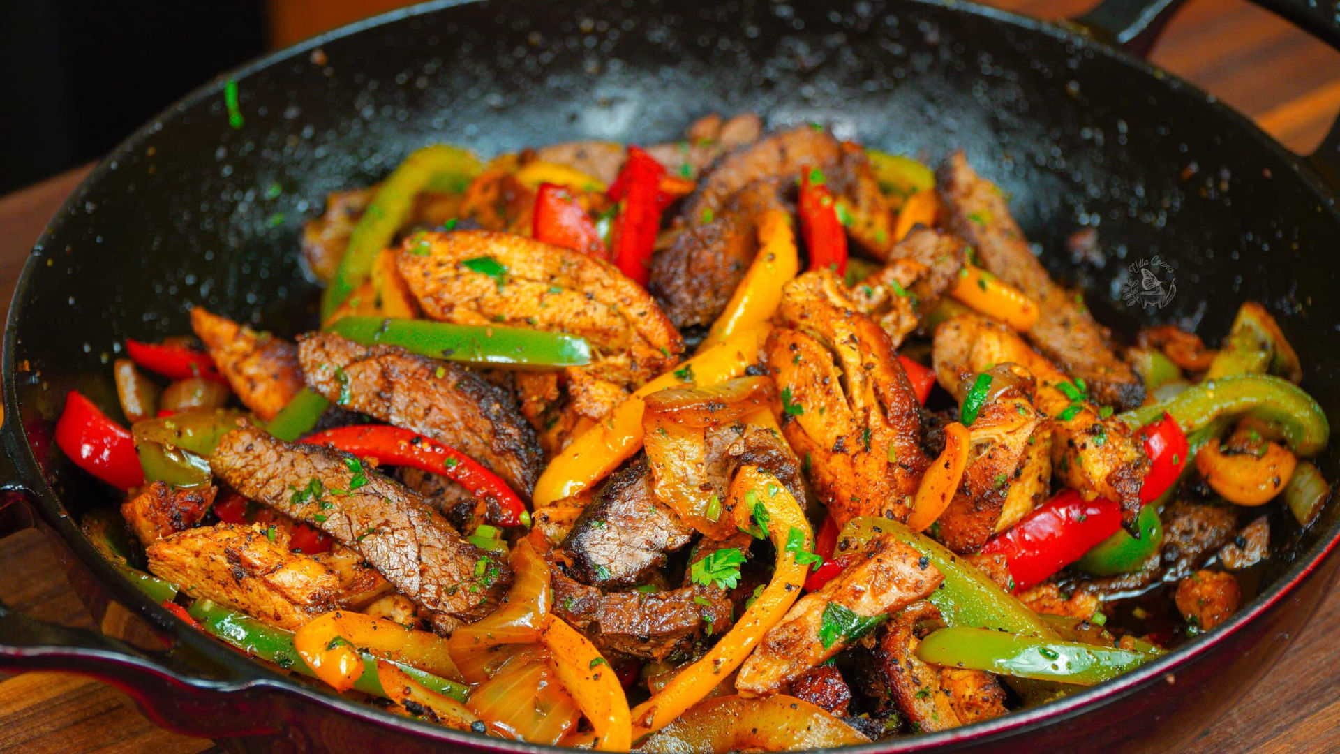 Steak and chicken fajitas cooking to order
